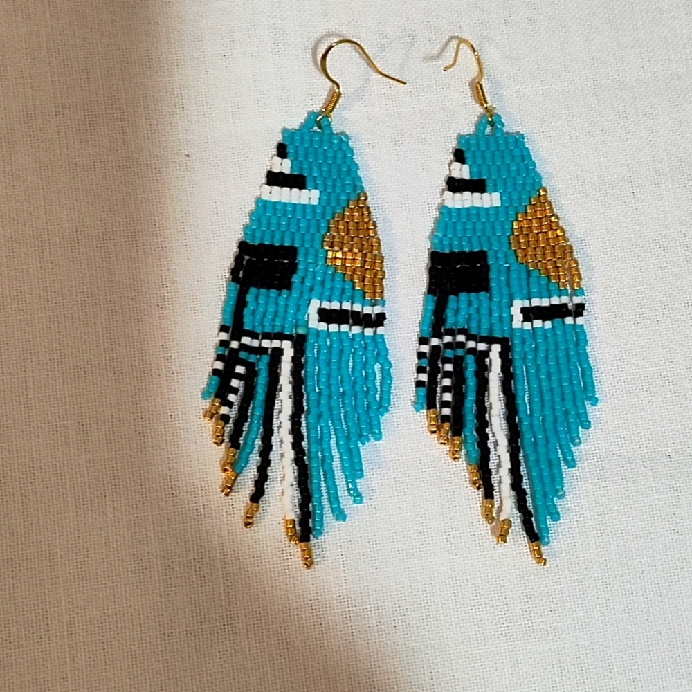 Handmade beaded geometric earrings with fringe.